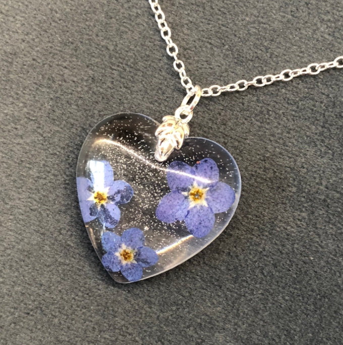 Delicate Floral pressed Forget me not flowers in epoxy resin necklace on 925 silver plated 18” chain with lobster claw fastener.Handmade  in Grimsby, England, United Kingdom