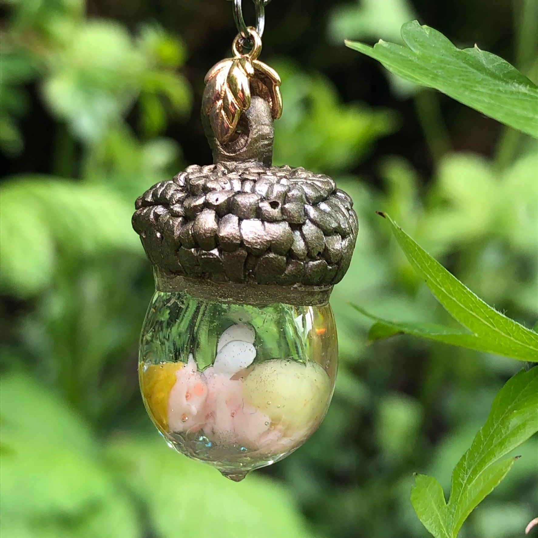 Hand-sculpted Acorn Fairy Baby with optional nappy colour keepsake NecHand-sculpted Acorn Fairy Baby with optional nappy colour keepsake Necklace Gift
🍄✨ Introducing our Hand Sculpted Acorn Fairy Baby Encapsulated in Crystal Clear ResnecklacePadpod & BerrieMy Fairytale GiftsHand-sculpted Acorn Fairy Baby