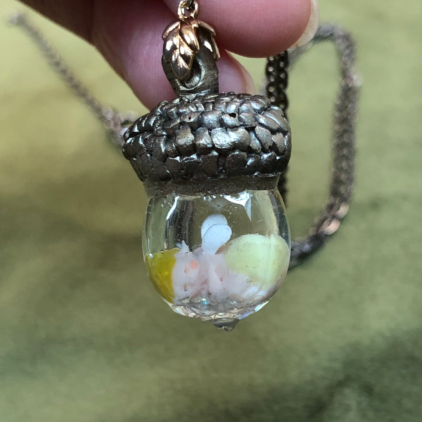 Hand-sculpted Acorn Fairy Baby with optional nappy colour keepsake NecHand-sculpted Acorn Fairy Baby with optional nappy colour keepsake Necklace Gift
🍄✨ Introducing our Hand Sculpted Acorn Fairy Baby Encapsulated in Crystal Clear ResnecklacePadpod & BerrieMy Fairytale GiftsHand-sculpted Acorn Fairy Baby