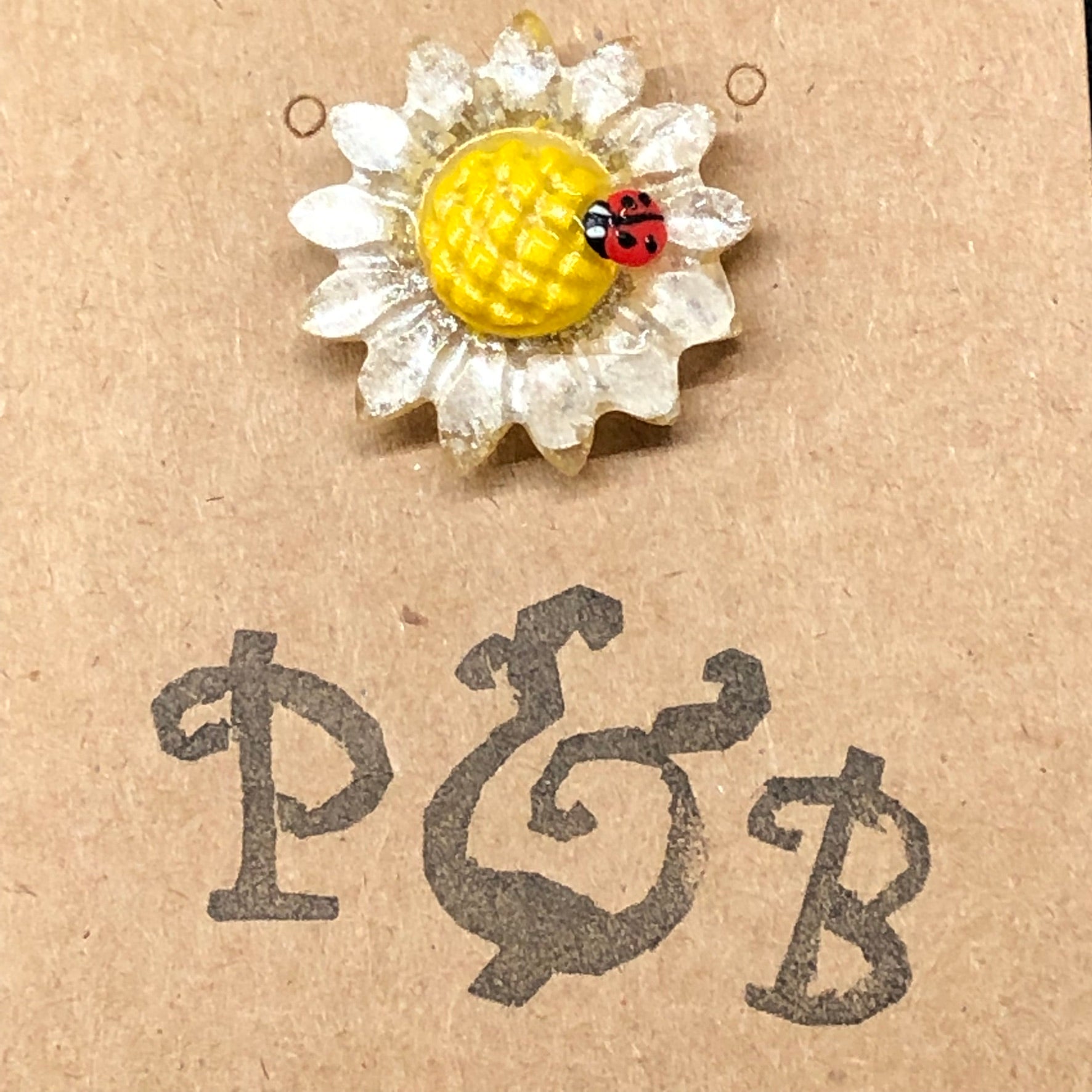 Daisy Flower lapel pin with miniature polymer clay ladybird handmade t

Introducing our enchanting Handmade Daisy flower with miniature polymer clay ladybird lapel pin - the perfect accessory to add a touch of whimsy to any outfit! 🌼?apel pinPadpod & BerrieMy Fairytale Giftsminiature polymer clay ladybird handmade