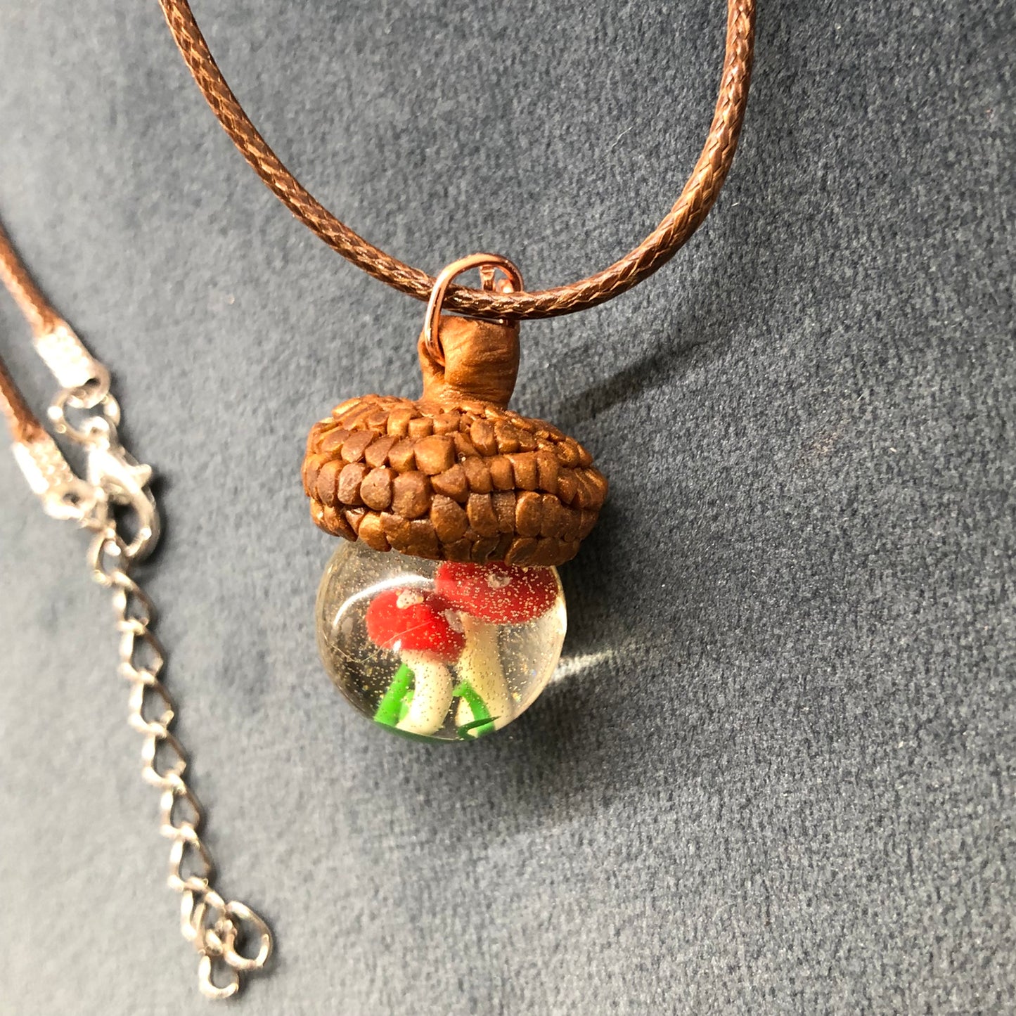 Acorn Necklace, handmade polymer clay acorn cap and tiny mushrooms insAcorn Necklace, handmade polymer clay acorn cap and tiny mushrooms inside crystal clear epoxy resin Pendant on waxed cotton thong necklace with lobster claw fastenernecklacePadpod & BerrieMy Fairytale GiftsAcorn Necklace, handmade polymer clay acorn cap