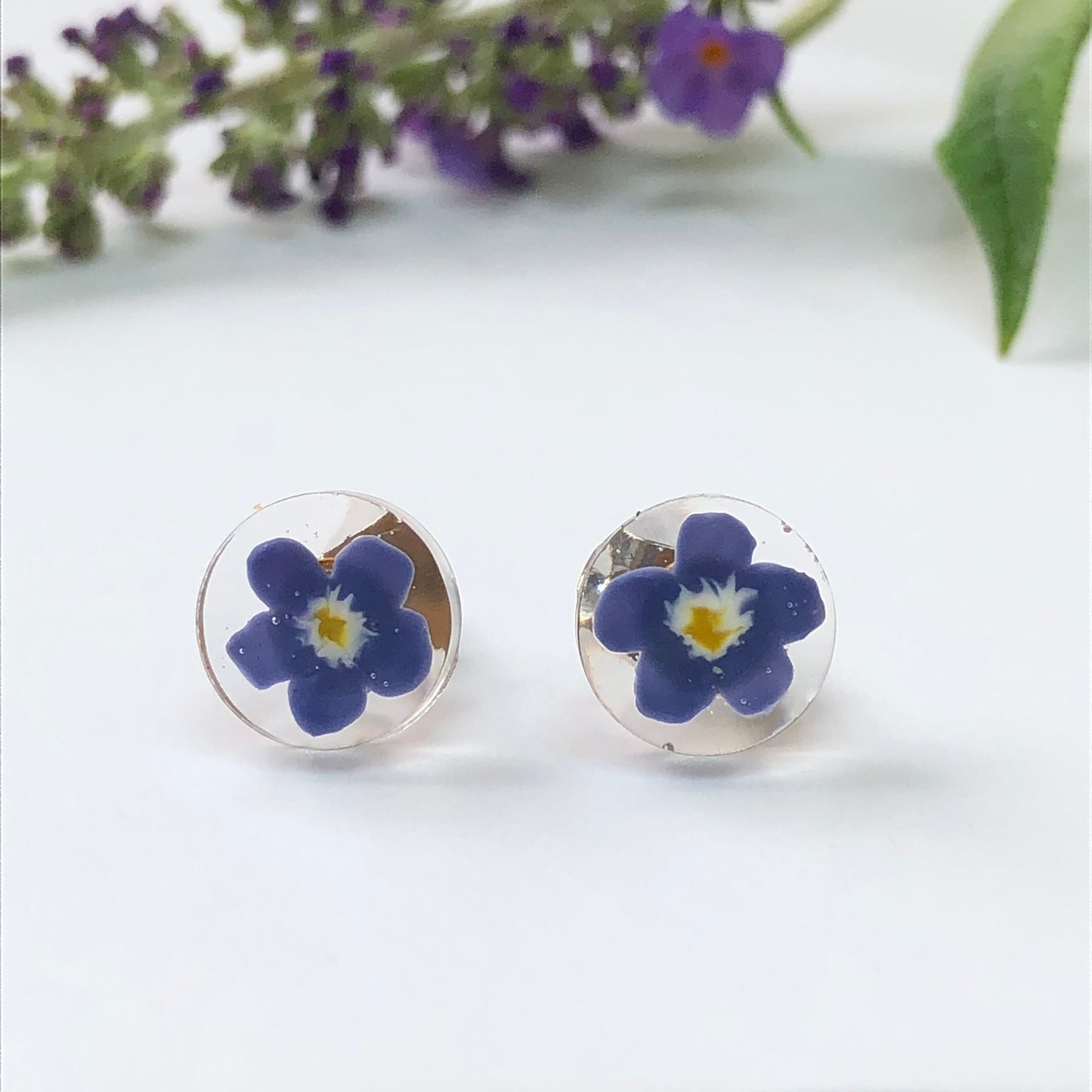 Handmade polymer clay forget me not flowers cast in crystal clear resiMiniature handmade polymer clay Forget-me-not flowers cast in crystal clear epoxy resin make for stunning stud earrings. These delicate creations are meticulously crStud earringsPadpodandberrieMy Fairytale Giftscrystal clear resin stud earrings