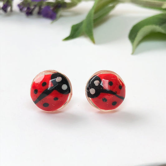 Miniature Handmade polymer clay ladybirds in crystal clear resin stud ✨🐞 Add a whimsical touch to your everyday style with our Miniature Handmade Polymer Clay Ladybird Earrings, beautifully cast in crystal clear epoxy resin. These vibLadybird Stud earringsPadpod & BerrieMy Fairytale GiftsMiniature Handmade polymer clay ladybirds