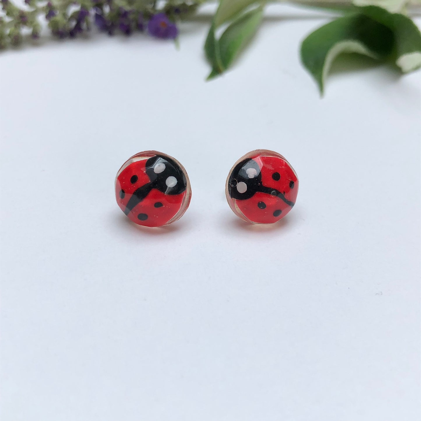 Miniature Handmade polymer clay ladybirds in crystal clear resin stud ✨🐞 Add a whimsical touch to your everyday style with our Miniature Handmade Polymer Clay Ladybird Earrings, beautifully cast in crystal clear epoxy resin. These vibLadybird Stud earringsPadpod & BerrieMy Fairytale GiftsMiniature Handmade polymer clay ladybirds