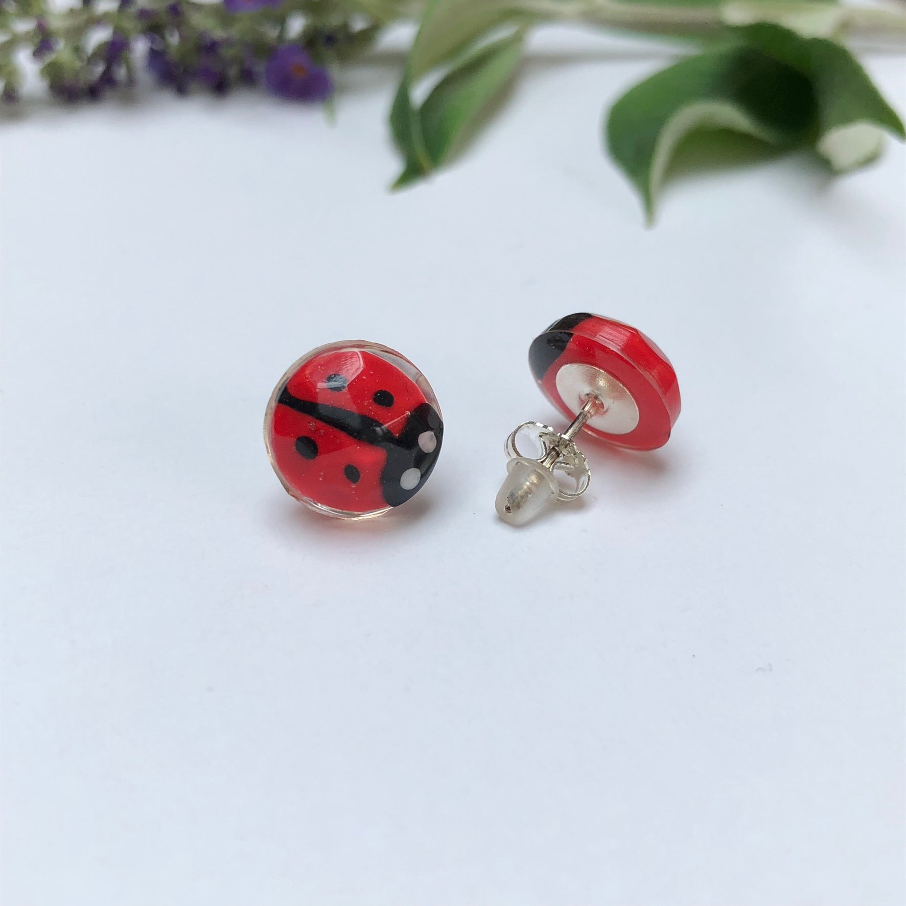 Miniature Handmade polymer clay ladybirds in crystal clear resin stud ✨🐞 Add a whimsical touch to your everyday style with our Miniature Handmade Polymer Clay Ladybird Earrings, beautifully cast in crystal clear epoxy resin. These vibLadybird Stud earringsPadpod & BerrieMy Fairytale GiftsMiniature Handmade polymer clay ladybirds