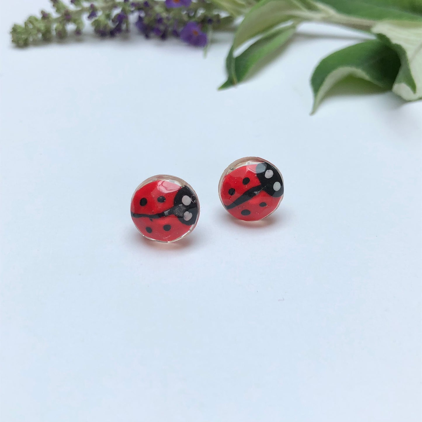 Miniature Handmade polymer clay ladybirds in crystal clear resin stud ✨🐞 Add a whimsical touch to your everyday style with our Miniature Handmade Polymer Clay Ladybird Earrings, beautifully cast in crystal clear epoxy resin. These vibLadybird Stud earringsPadpod & BerrieMy Fairytale GiftsMiniature Handmade polymer clay ladybirds