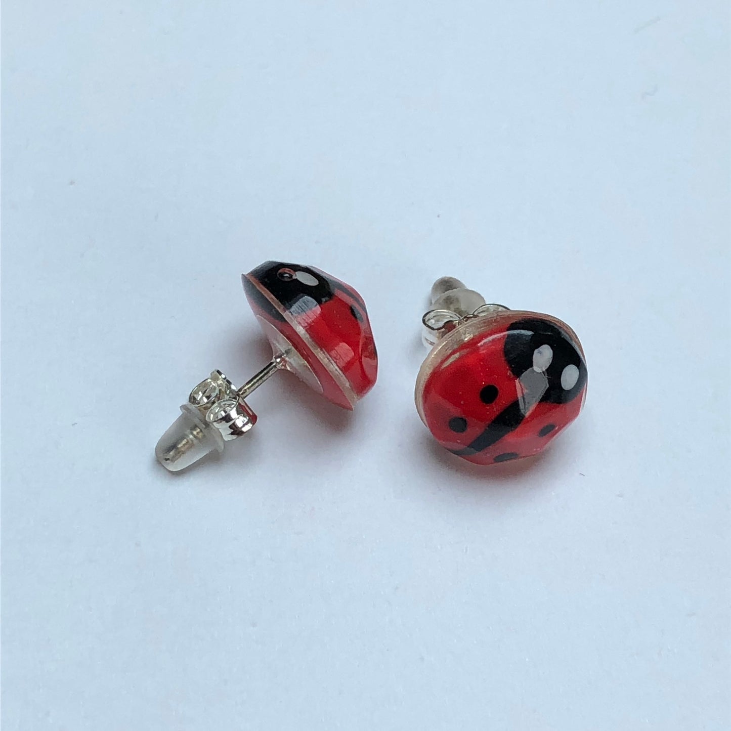 Miniature Handmade polymer clay ladybirds in crystal clear resin stud ✨🐞 Add a whimsical touch to your everyday style with our Miniature Handmade Polymer Clay Ladybird Earrings, beautifully cast in crystal clear epoxy resin. These vibLadybird Stud earringsPadpod & BerrieMy Fairytale GiftsMiniature Handmade polymer clay ladybirds