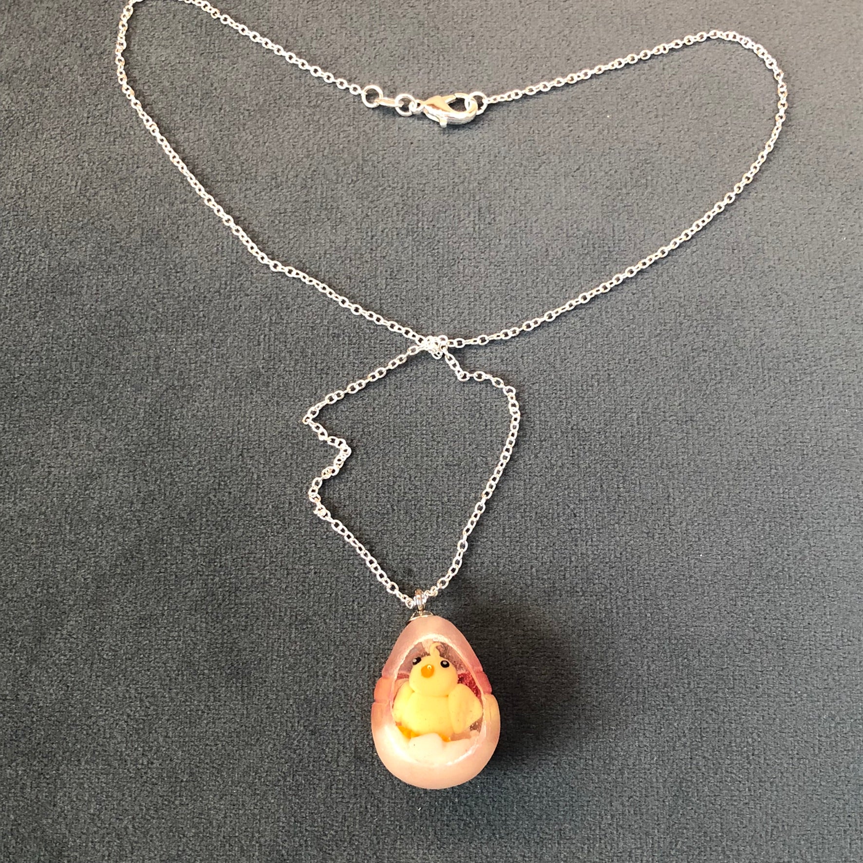 my hand sculpted polymer clay chick Secret Egg necklace Ooak jewellery, my hand sculpted polymer clay chick inside hand poured epoxy resin egg which is made from my handmade silicone mold. Secret Egg nnecklacePadpodandberrieMy Fairytale Giftshand sculpted polymer clay chick inside hand poured epoxy resin egg